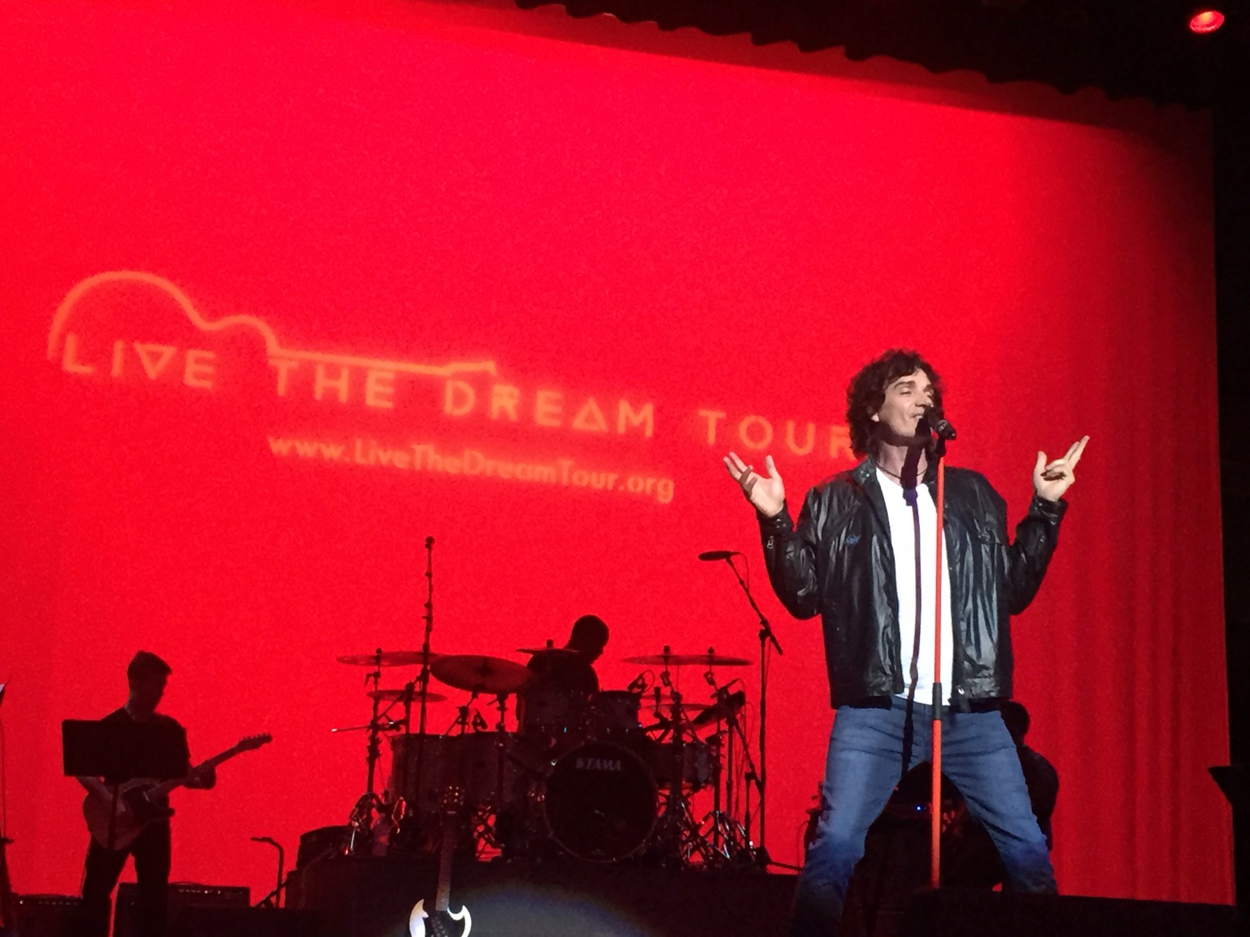 Jon Mullane performance portrait with guitar