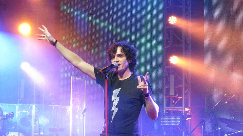 Jon Mullane performing with guitar